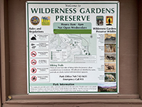 Kiosk displays park rules, map, and wildlife info.